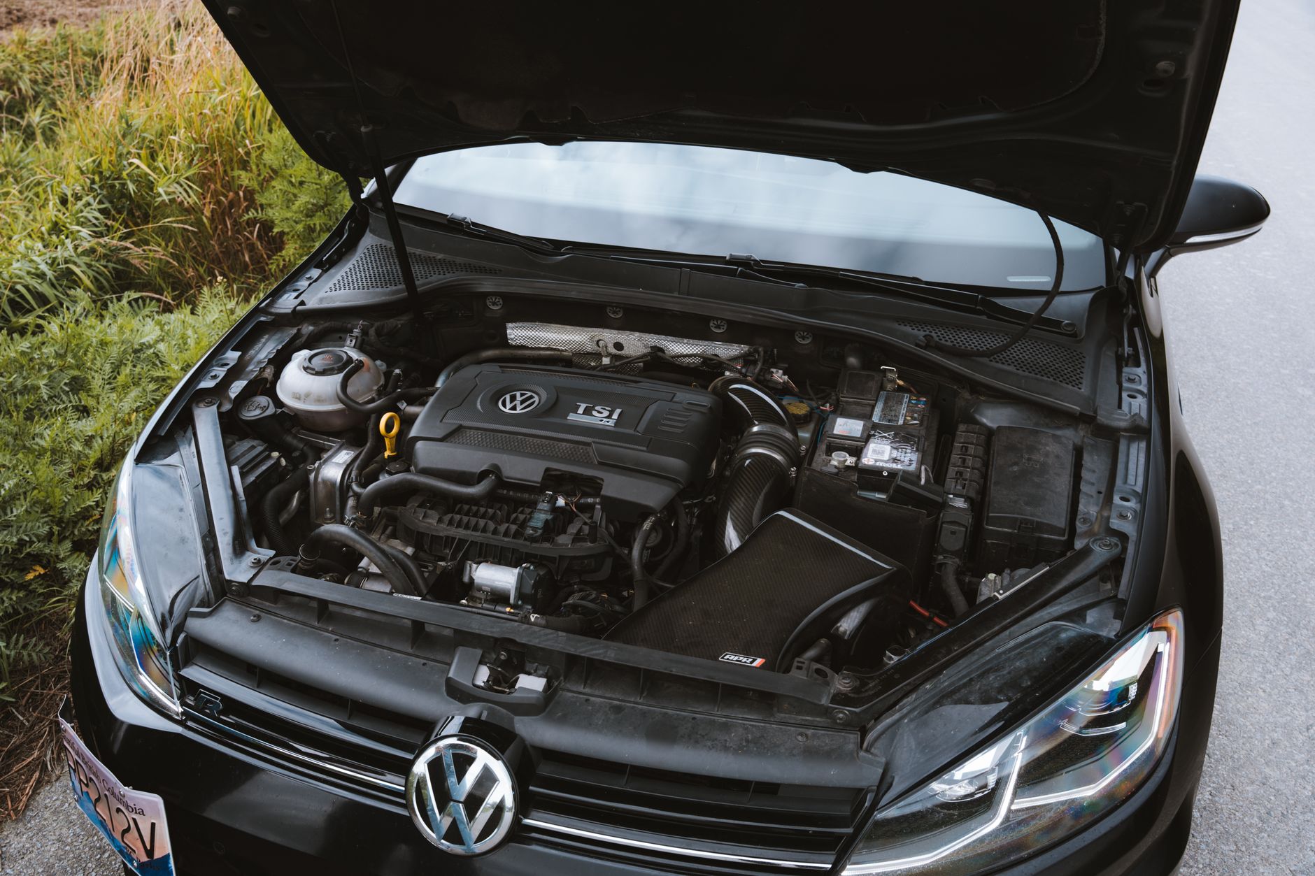 Car engine bay with the hood open