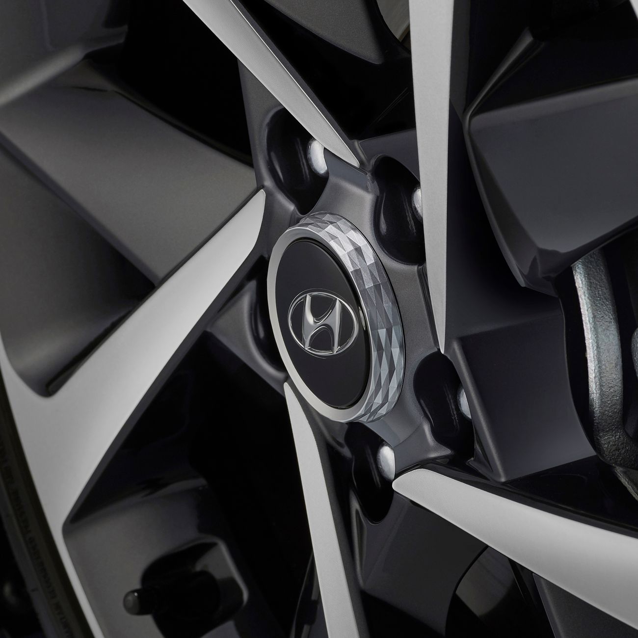 A close-up of an alloy wheel rim with its centre logo