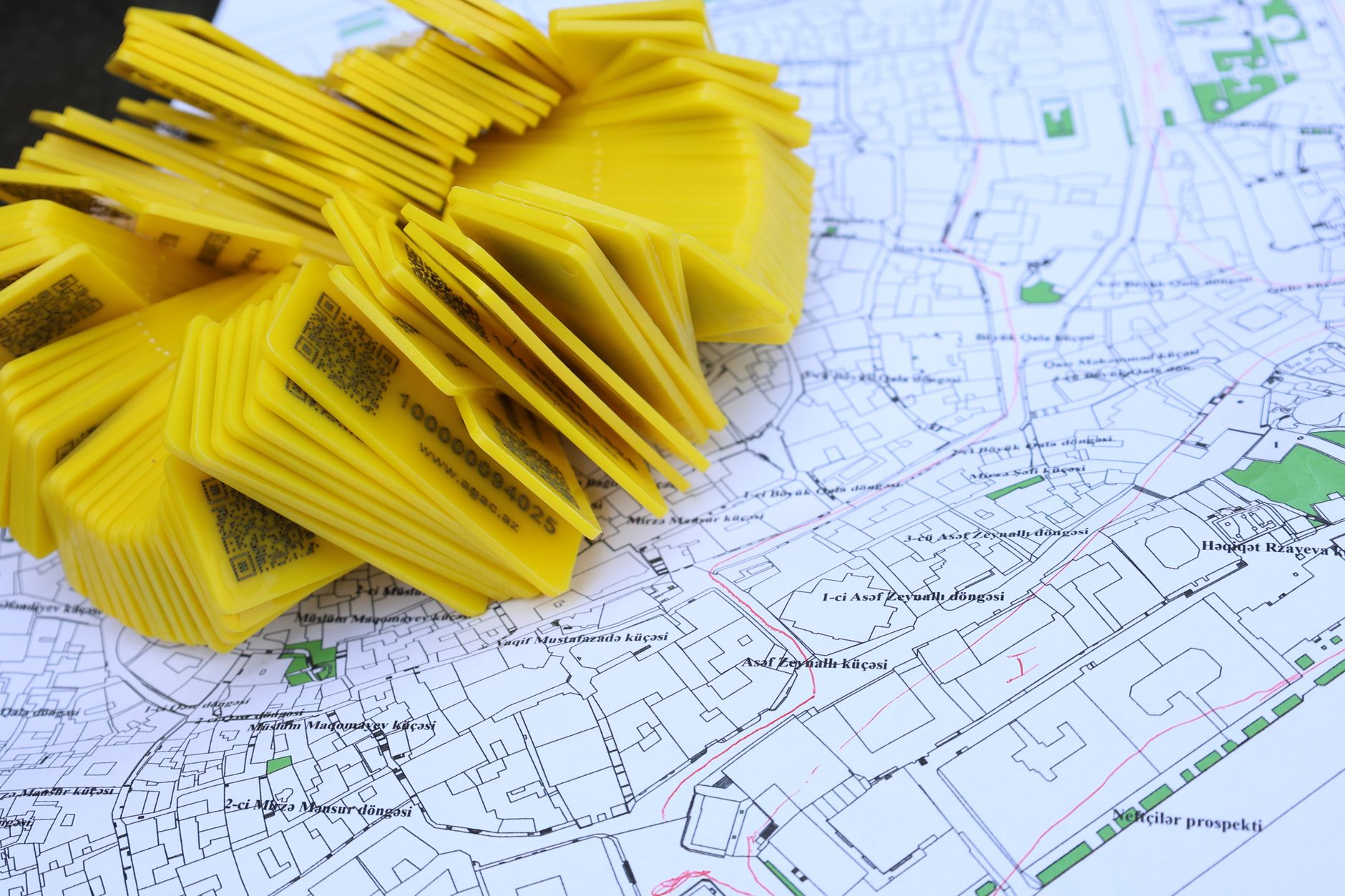 A street map with yellow location markers placed on it