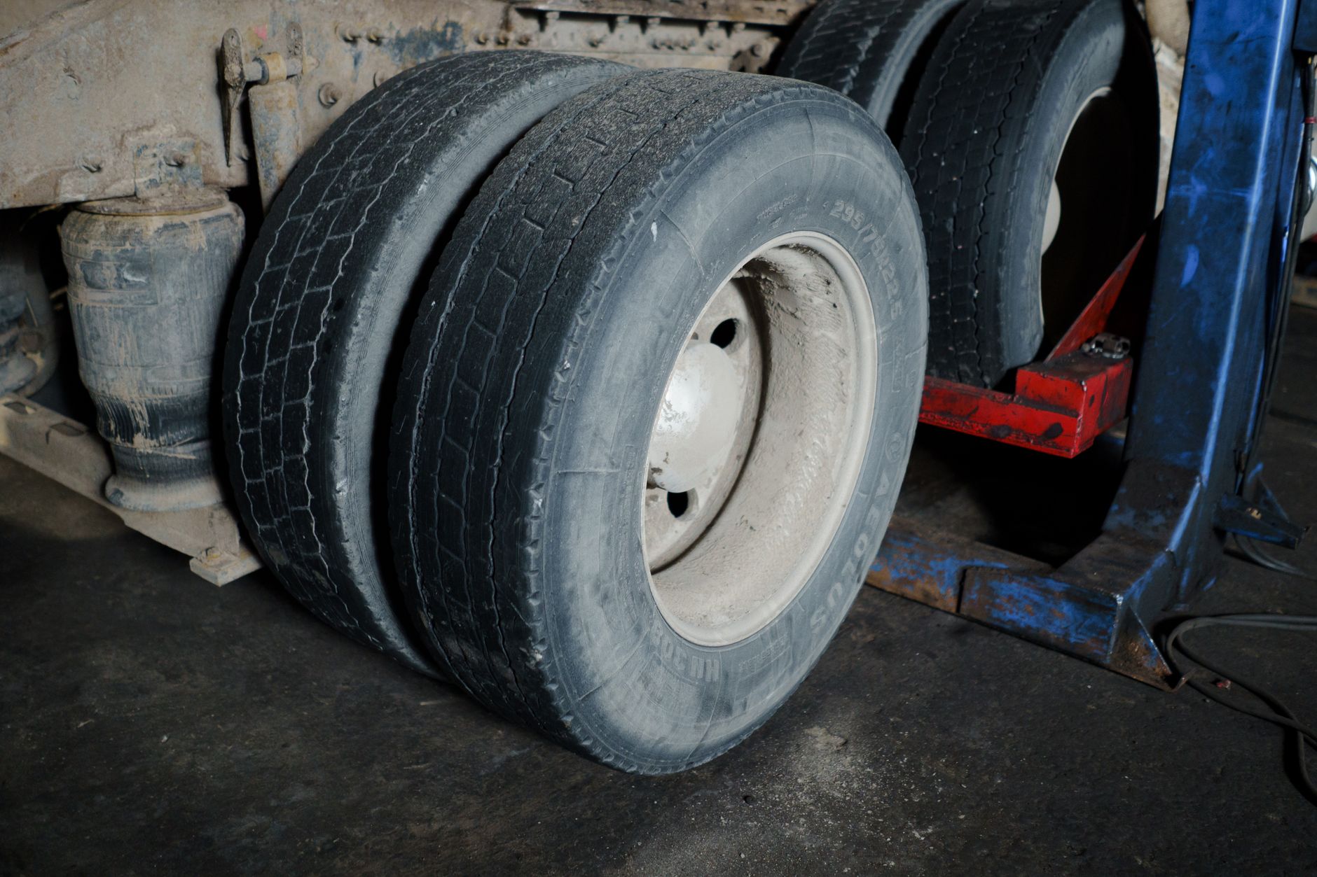 Worn truck tyres waiting for maintenance