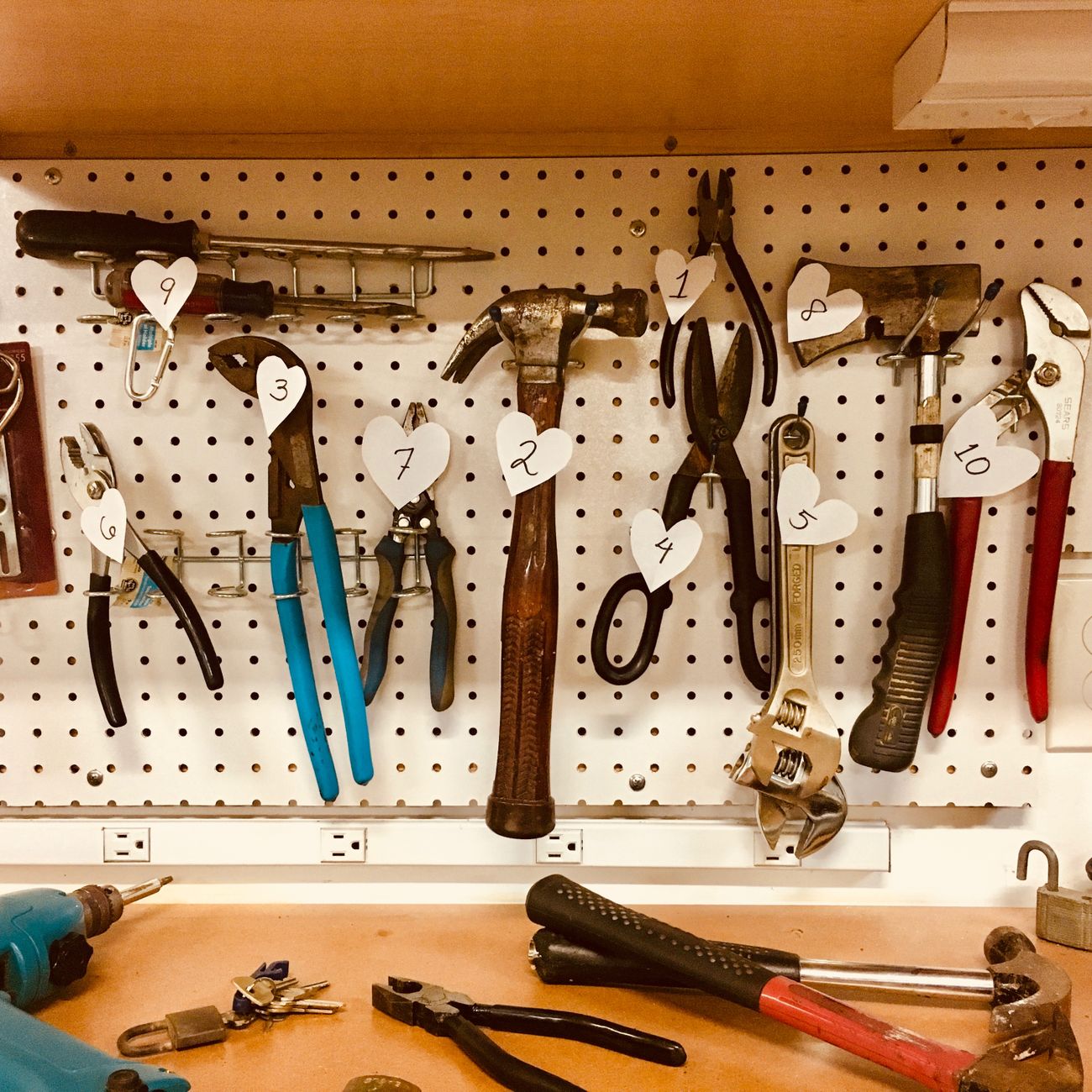 Picture of tools arranged on a pegboard in a workshop