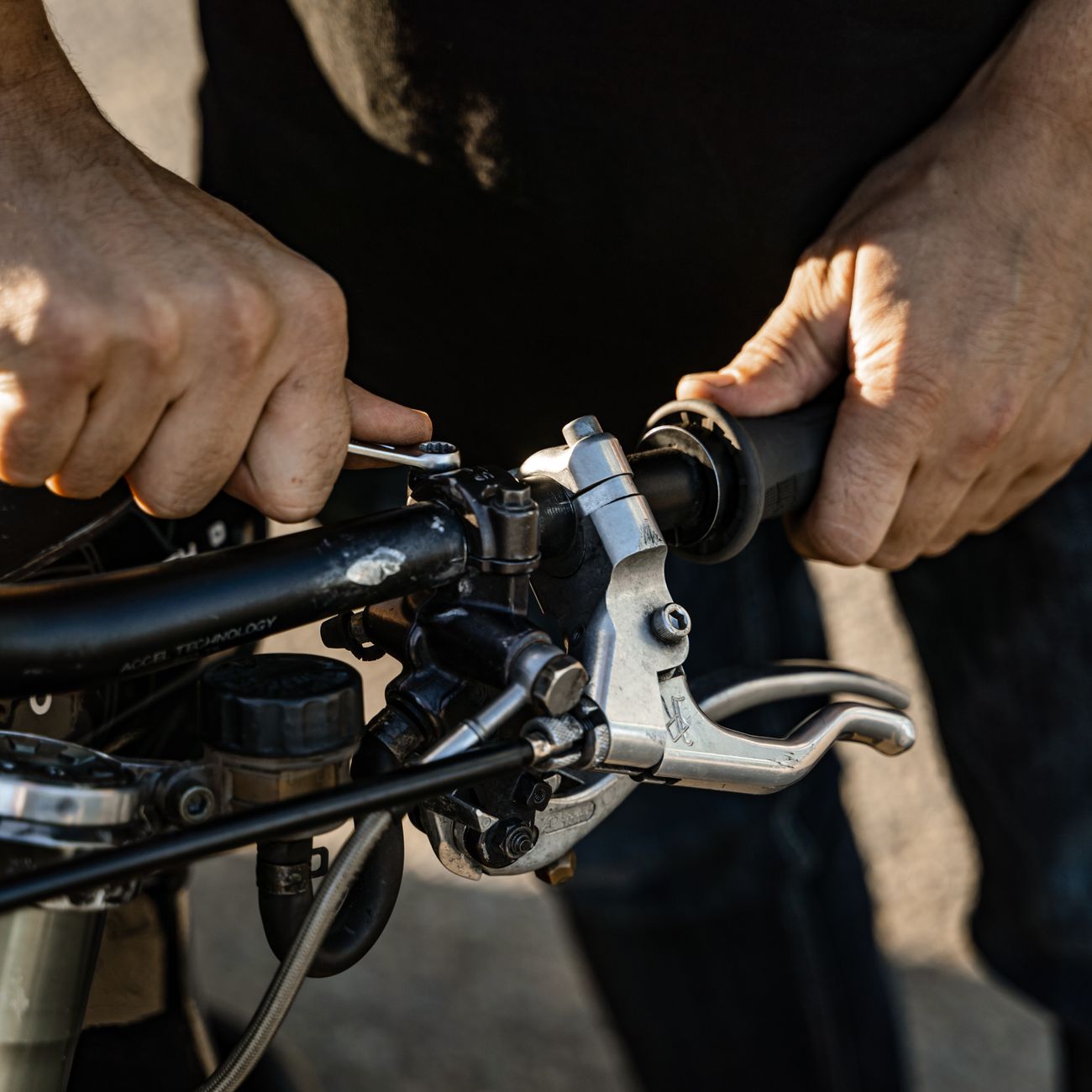 Picture of a gear and a motorcycle part being repaired