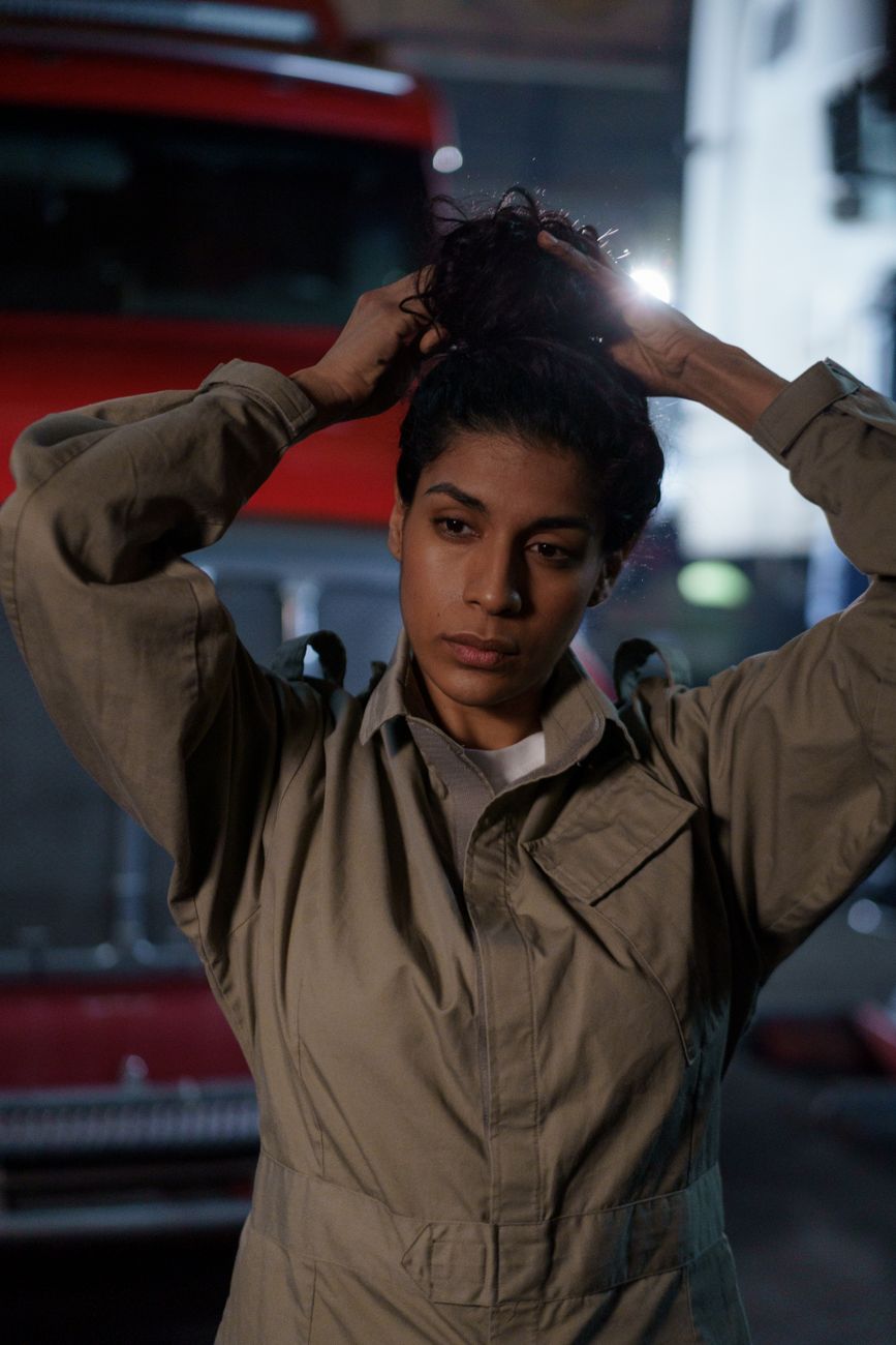 A confident woman mechanic in the garage