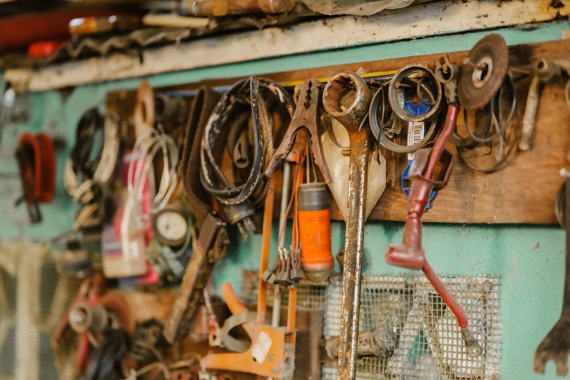 Wrenches and hand tools hanging on the workshop wall