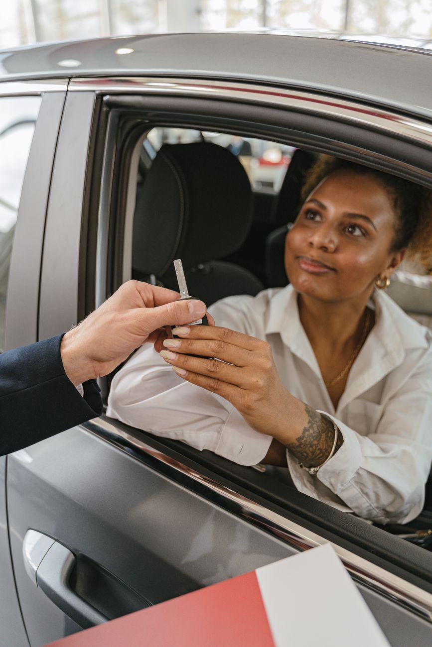 A customer receiving car keys from a service person