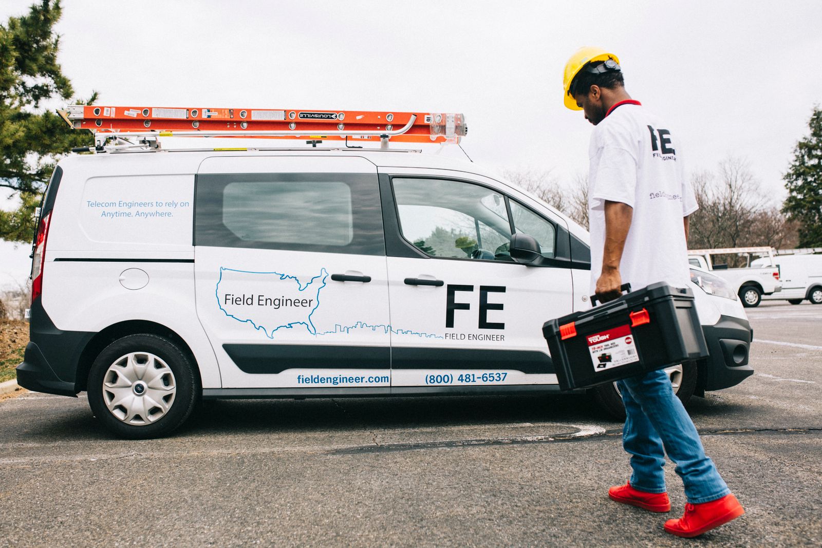 Electrical field technician with diagnostic equipment and fleet vehicle