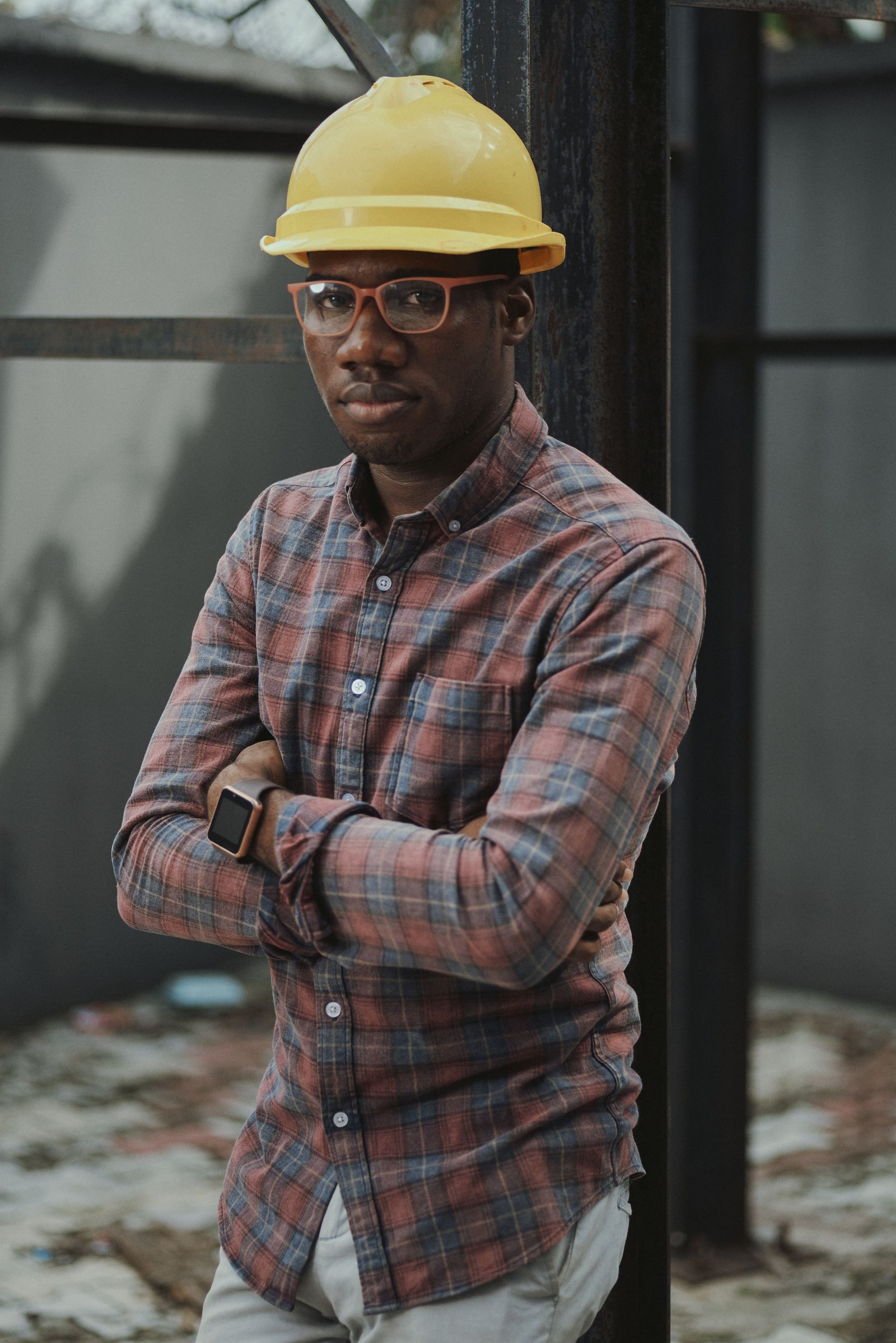 Certified master electrician with protective helmet on engineering site